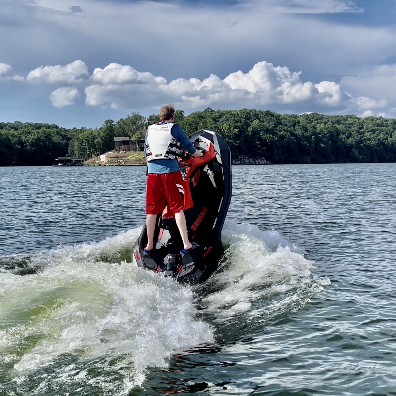 Photo of Ryan, site contributor, doing a wheelie on a Sea Doo Spark Trixx